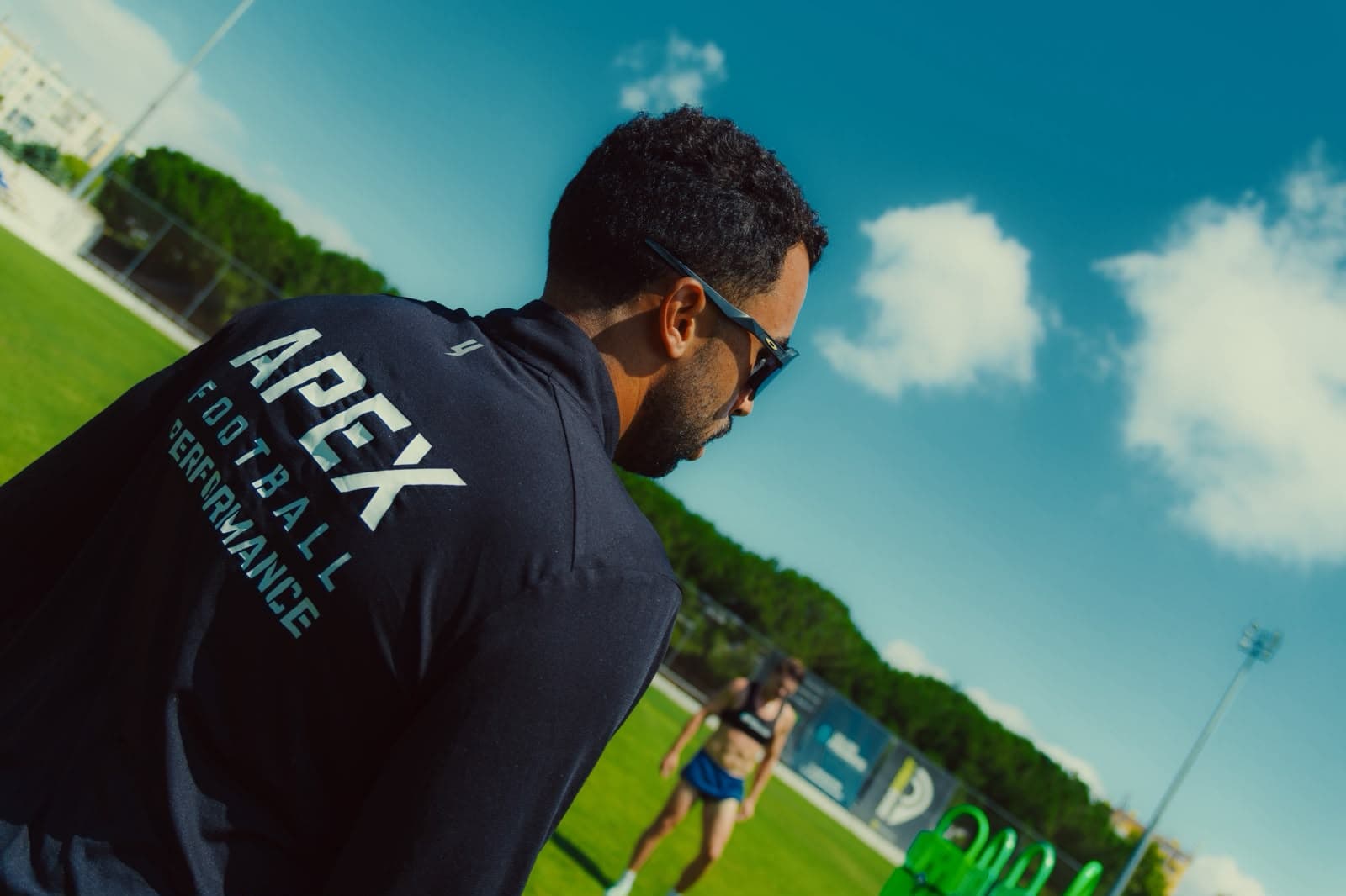 Apex Football Performance coach overseeing a training session on the pitch